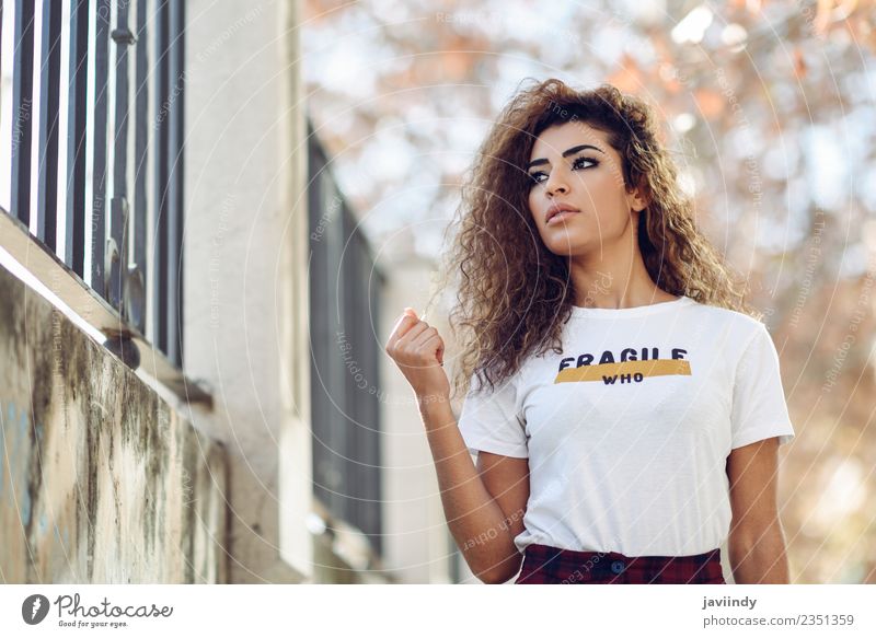 Beautiful young Arab woman with black curly hairstyle Lifestyle Style Hair and hairstyles Face Human being Young woman Youth (Young adults) Woman Adults 1