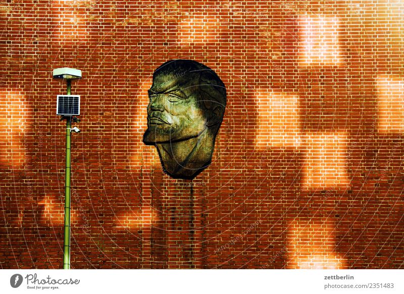 Lenin House (Residential Structure) Wall (building) Facade Wall (barrier) Brick Building Art Portrait photograph Face Soviet Union Light Patch of light Lantern