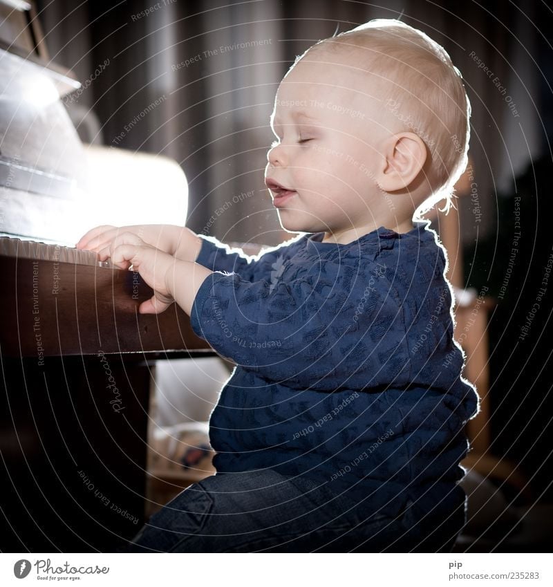 pianissimo Playing Make music Piano Play piano Music Human being Masculine Baby Toddler Face Ear Mouth Hand Fingers 1 - 3 years Sit Joy Happiness Education