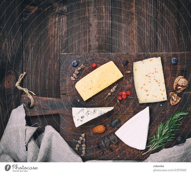 different cheeses Food Cheese Nutrition Table Wood Old Eating Blue Yellow White board Brie roquefort cheddar Difference Meal Snack Gourmet Ingredients french