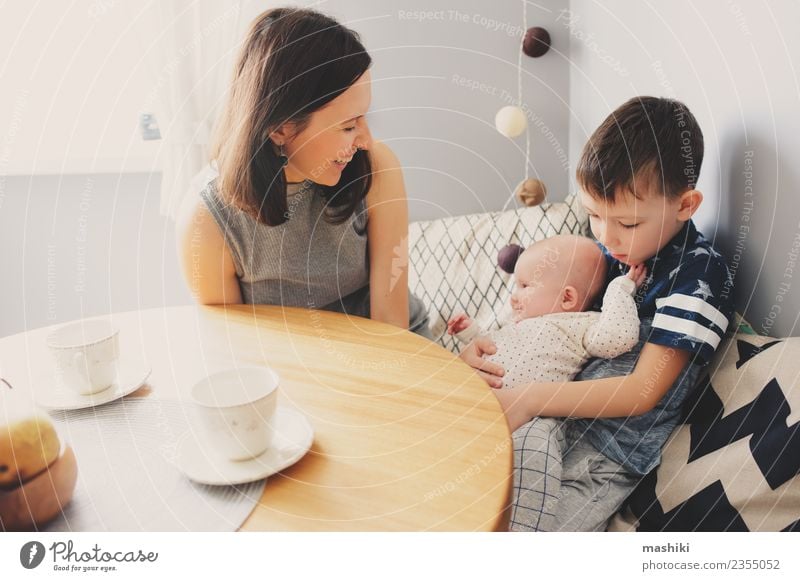 happy family in kitchen Human being Child Baby Boy (child) Woman Adults Parents Mother Brothers and sisters Family & Relations Happiness Kitchen Breakfast Joy