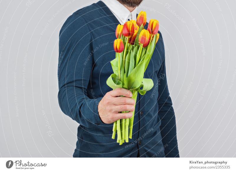 Man with a beard holding bouquet of tulips Happy Beautiful Flirt Feasts & Celebrations Valentine's Day Human being Adults Mother Hand Flower Tulip Beard Bouquet