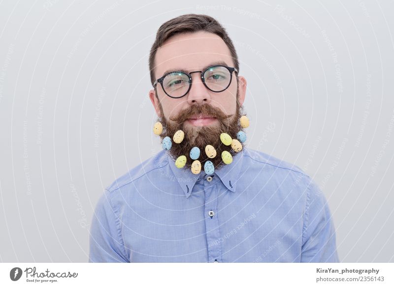 Portrait of bearded man in eyeglasses with Easter egg decoration in beard Lifestyle Style Happy Face Decoration Feasts & Celebrations Human being Man Adults