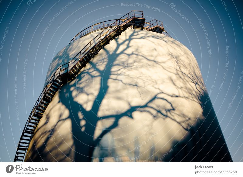 time to refuel Energy industry Tank Cloudless sky Winter Beautiful weather Stairs Warmth Moody Surrealism Change Time Shadow play Illusion Vignetting Abstract