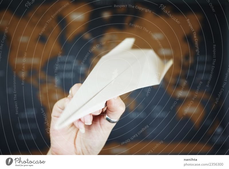 Paper airplane against a map background Design Exotic Leisure and hobbies Playing Vacation & Travel Tourism Trip Adventure Far-off places Freedom Transport