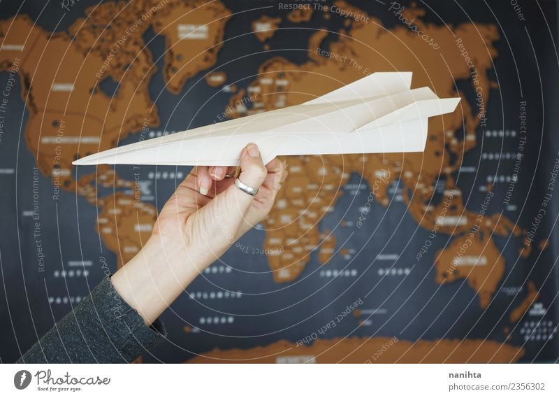 Origami paper plane against a map of the world Lifestyle Leisure and hobbies Handcrafts Paper Vacation & Travel Tourism Trip Adventure Far-off places Freedom
