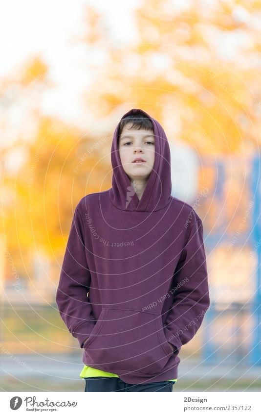 Teen boy in hood over park nature background. Lifestyle Beautiful Face Child Human being Masculine Boy (child) Man Adults Infancy 1 8 - 13 years Nature Autumn