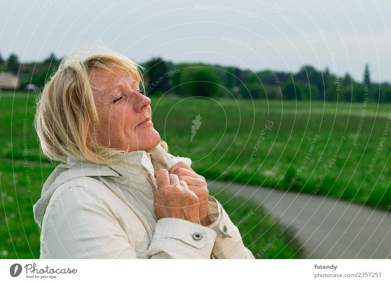 take deep breaths Beautiful Human being Feminine Woman Adults 1 45 - 60 years Nature Landscape Spring Meadow Field Lanes & trails Jacket Blonde Long-haired Old