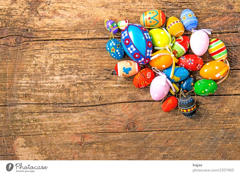 colourful Easter eggs on a board Multicoloured Religion and faith Tradition variegated colored Heap Mixed cheerful wood board text space Free space decoration