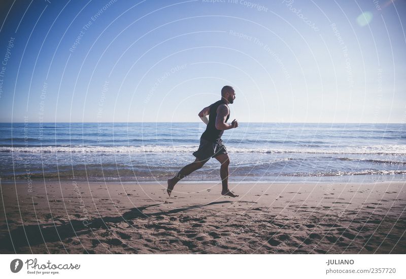sports man doing quick run at the beach Young man Sports workout Beach Fitness Sports Training Hard Perspire Musculature Joy Sportsperson Speed Positive Healthy