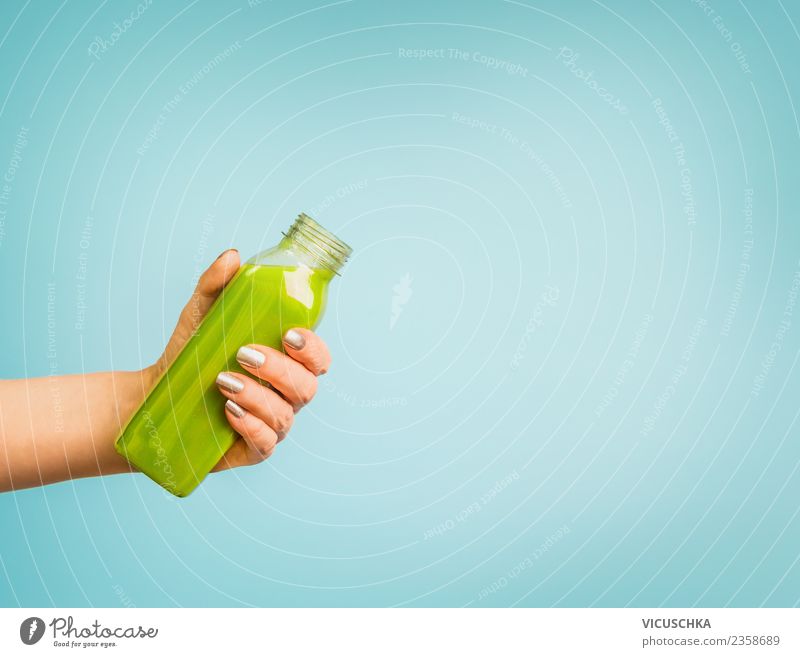 Hand with green smoothie bottle Beverage Cold drink Lemonade Juice Style Design Healthy Healthy Eating Summer Human being Feminine Woman Adults Vitamin Bottle