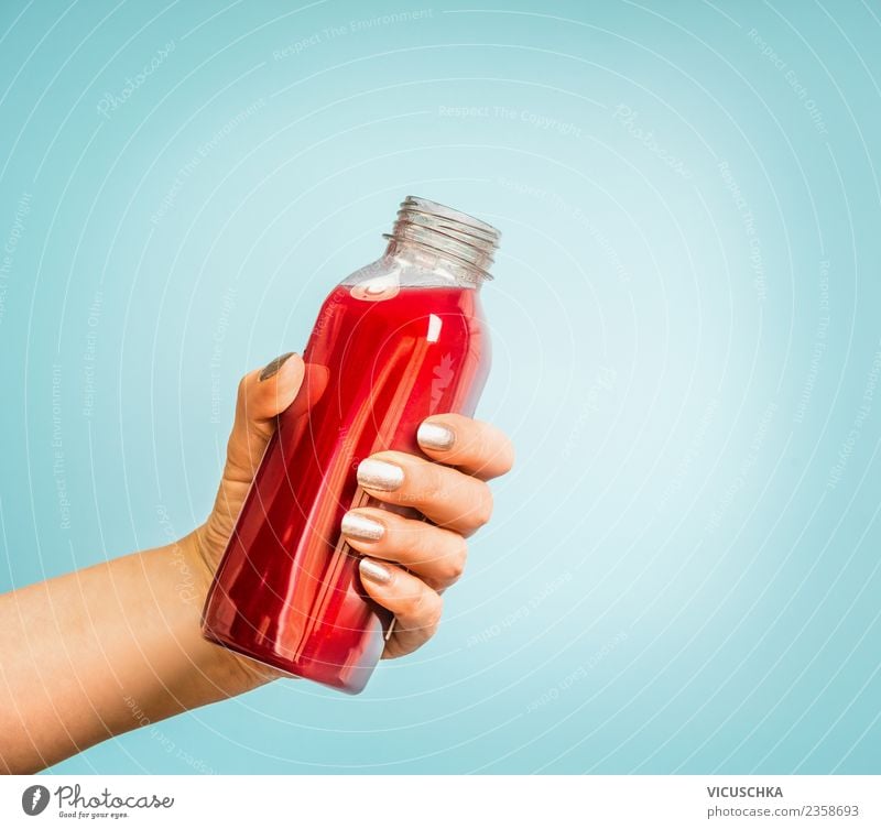Hand with juice or smoothie bottle Beverage Cold drink Lemonade Juice Style Design Healthy Healthy Eating Summer Human being Feminine Woman Adults Vitamin