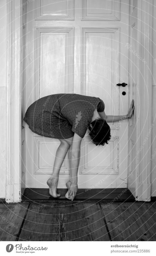 On the threshold - woman stands at the door in a strangely bent posture Floorboards Doorframe Doorstep Feminine Young woman Youth (Young adults) Legs Feet Dress