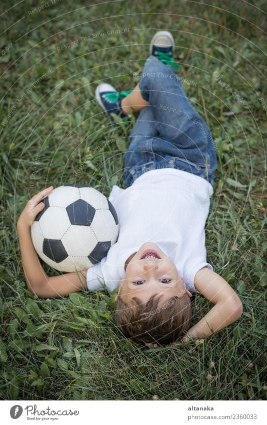 Portrait of a young boy with soccer ball. Lifestyle Joy Happy Relaxation Leisure and hobbies Playing Summer Sports Soccer Child Human being Boy (child) Man