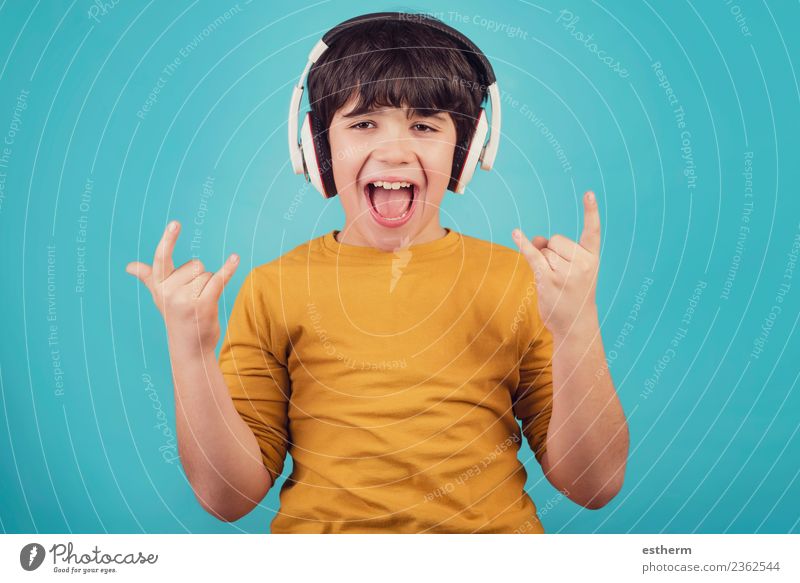 Boy with headphones showing rock sigh Lifestyle Joy Party Event Feasts & Celebrations Headset Human being Masculine Child Toddler Boy (child) Infancy 1