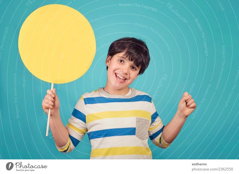 Boy holding a yellow sign on blue background Lifestyle Joy Adventure Party Event Feasts & Celebrations Birthday Human being Masculine Child Toddler Infancy 1