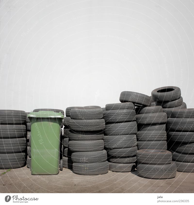 tyre testing Wall (barrier) Wall (building) Facade Tire Car tire Trash container Lie Stack Rubber Colour photo Exterior shot Deserted Copy Space top