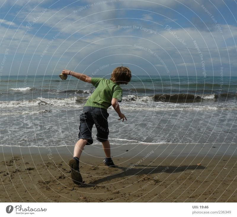 Slingshot. Life Playing Child Boy (child) 1 Human being 8 - 13 years Infancy Sand Water Sky Clouds Horizon Beautiful weather Wind Waves Coast Beach Ocean