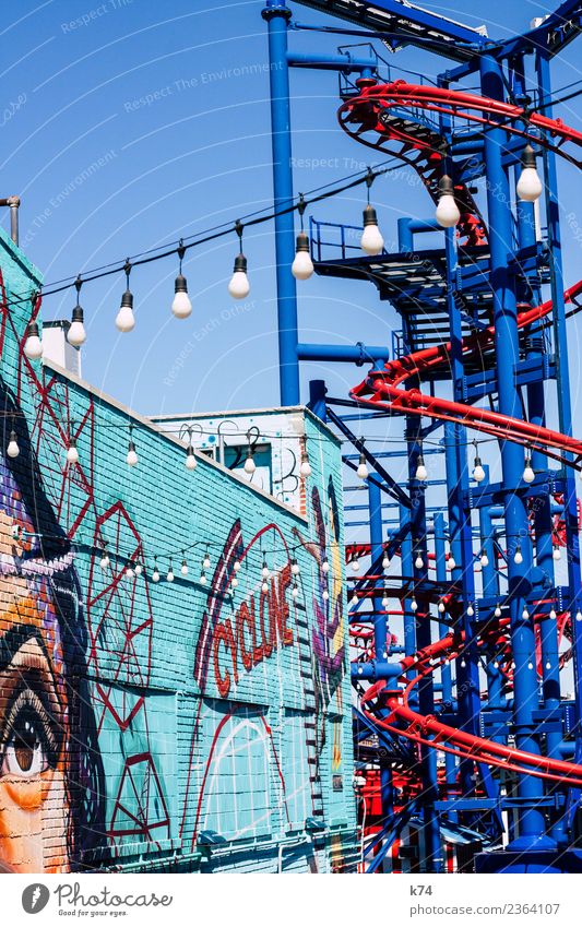 NYC - Luna Park Coney Island - CYCLONE Feminine Woman Adults Eyes 1 Human being Cloudless sky Beautiful weather Wall (barrier) Wall (building) Graffiti Blue Red