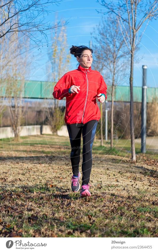 Runner woman jogging at the park Lifestyle Happy Beautiful Relaxation Leisure and hobbies Winter Sports Track and Field Sportsperson Jogging Work and employment