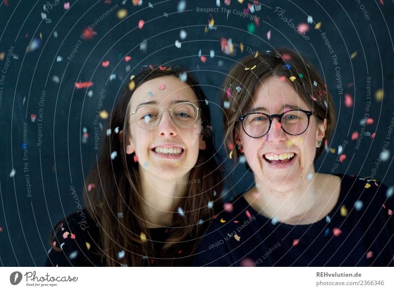 2 women with confetti Front view Upper body portrait Shallow depth of field blurriness Day Neutral Background Studio shot Interior shot Confetti Life Success