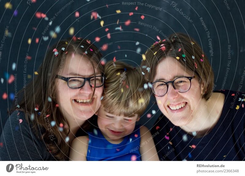 Two women with child and confetti Lifestyle Leisure and hobbies Party Feasts & Celebrations Birthday Human being Masculine Feminine Child Boy (child)