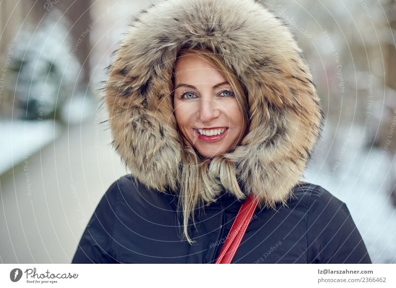 Portrait of smiling woman wearing winter hood Lifestyle Happy Beautiful Face Winter Snow Woman Adults 1 Human being 30 - 45 years Park Fashion Coat Fur coat