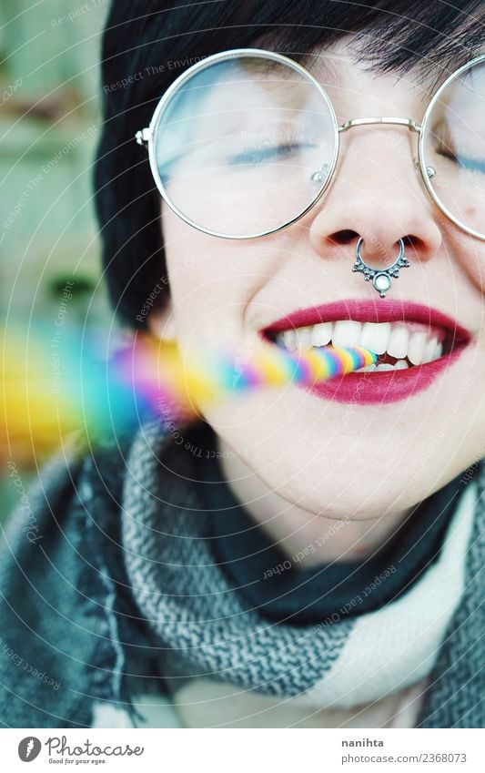 Young and happy woman with a rainbow straw in her mouth Lifestyle Style Exotic Joy Beautiful Hair and hairstyles Skin Face Wellness Leisure and hobbies