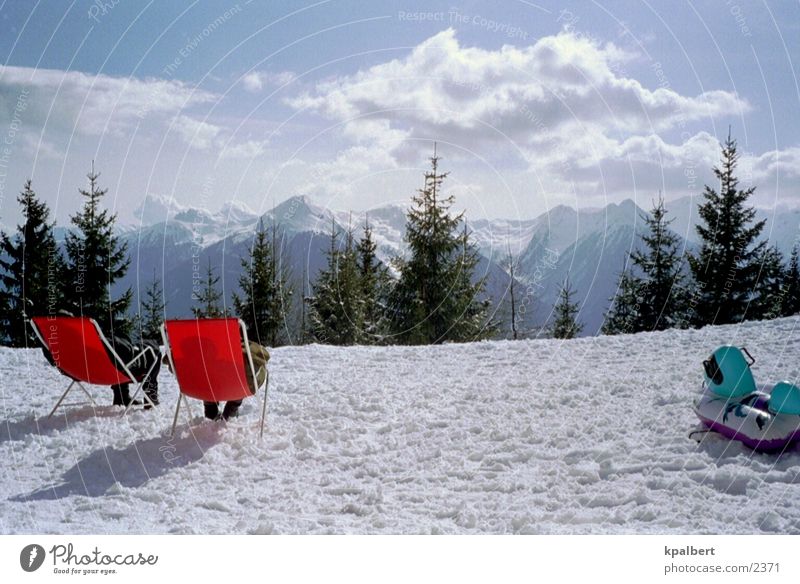Sunbathing in the snow Deckchair Vacation & Travel Snow Mountain