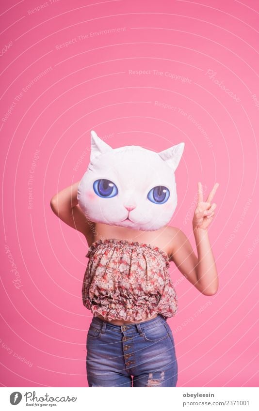 Young slim girl with a cat pillow over her face Elegant Happy Beautiful Body Hair and hairstyles Skin Face Make-up Medical treatment Wellness Spa Woman Adults