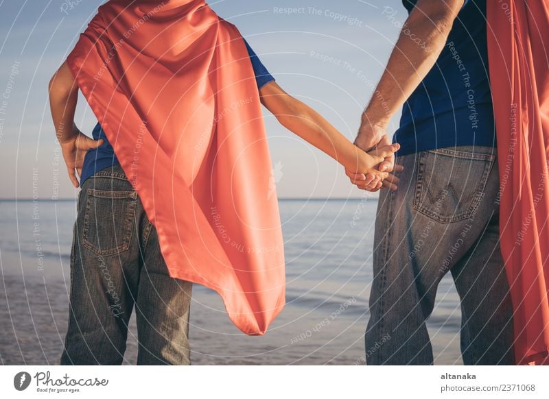 Father and son playing superhero on the beach at the day time. Lifestyle Joy Happy Relaxation Leisure and hobbies Playing Vacation & Travel Adventure Freedom