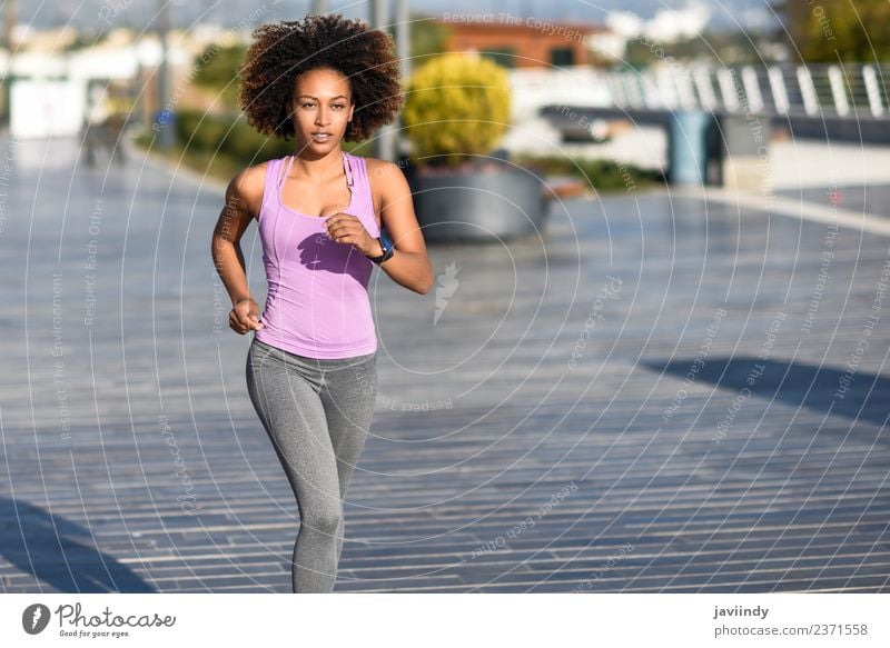 Black woman, afro hairstyle, running outdoors Lifestyle Beautiful Hair and hairstyles Wellness Leisure and hobbies Sports Jogging Human being Young woman