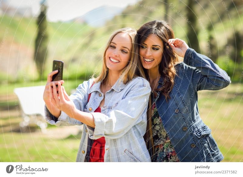 Two young women taking a selfie photograph Lifestyle Style Joy Happy Beautiful Summer Telephone Camera Human being Feminine Young woman Youth (Young adults)