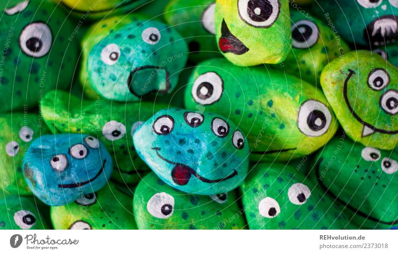 Monster Stones | green Handicraft Exceptional Uniqueness Funny Green Joy Idea Inspiration Creativity Face Eyes Painted Colour photo Interior shot Day Blur