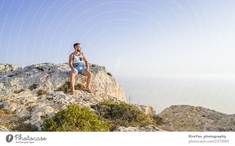 Man enjoys beautiful nature view of Malta Lifestyle Wellness Harmonious Relaxation Meditation Leisure and hobbies Vacation & Travel Freedom Summer Ocean Hiking