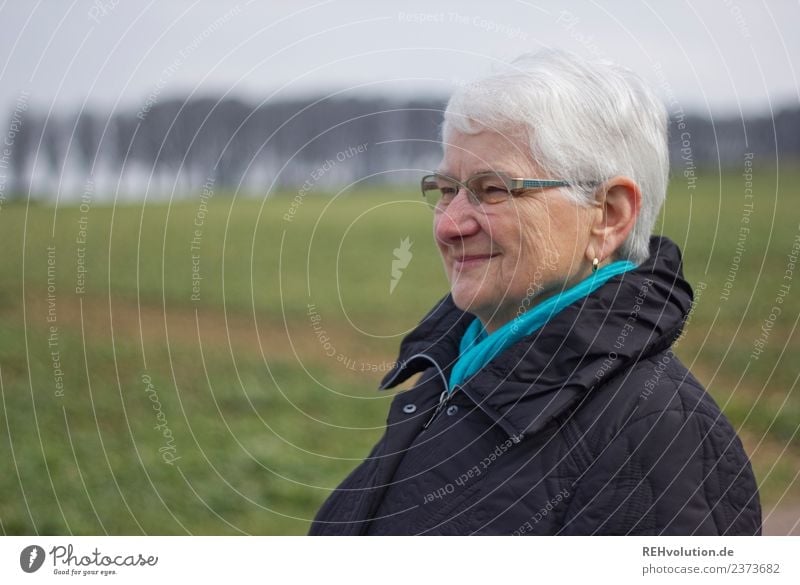 Senior smiles Human being Feminine Female senior Woman Grandmother Senior citizen Face 1 60 years and older Environment Nature Landscape Meadow Field Jacket