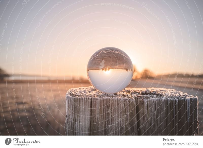 Glass orb on a wooden post in the sunrise Beautiful Meditation Vacation & Travel Sun Winter Snow Christmas & Advent Environment Nature Landscape Sky Autumn