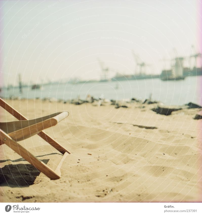 a day at the beach Relaxation Summer Sunbathing Beach Chair Industry Sand Warmth Harbour To enjoy Yellow Calm Loneliness Indifferent Comfortable Elbe Deckchair
