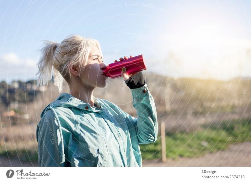 Blonde girl drinking water during morning jogging Bottle Lifestyle Beautiful Summer Sports Track and Field Sportsperson Jogging Human being Feminine Young woman
