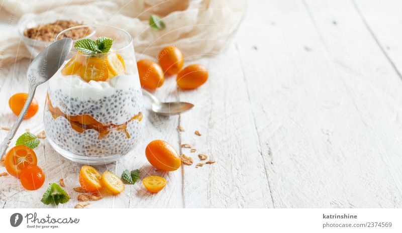 Chia pudding parfait, layered with kumquat and granola Yoghurt Fruit Dessert Eating Breakfast Diet Bowl Spoon Bright Green White Colour Cereal chia Pudding seed