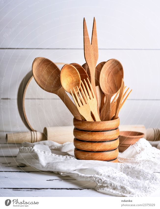 wooden spoons and forks Cutlery Fork Spoon Table Kitchen Tool Sieve Wood Brown White Tradition food Rustic background utensils cooking space eat equipment