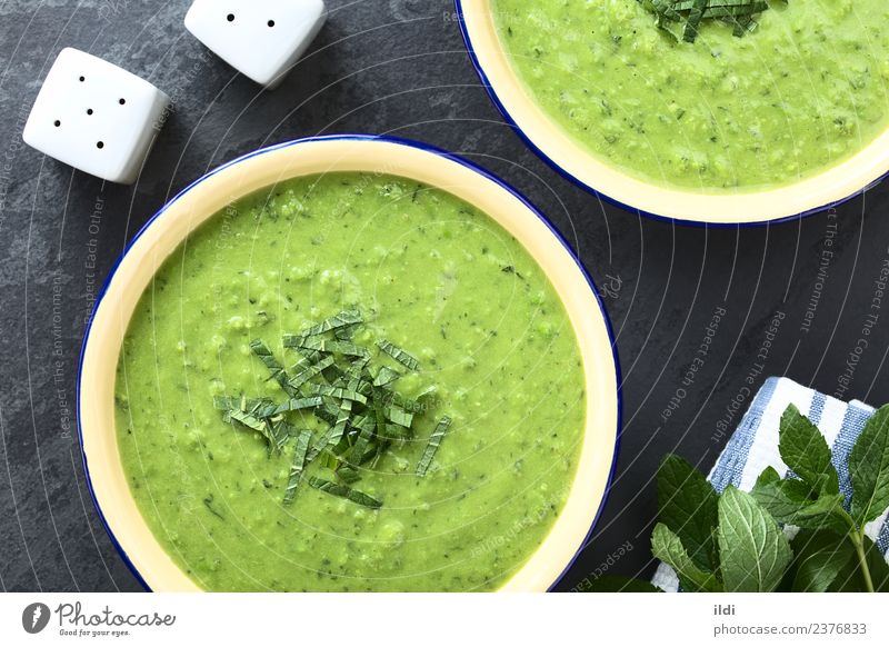 Fresh Green Pea and Mint Soup Vegetable Stew Herbs and spices food green pea cream Creamy pureed blended Home-made appetizer Meal Dish Refreshment seasonal