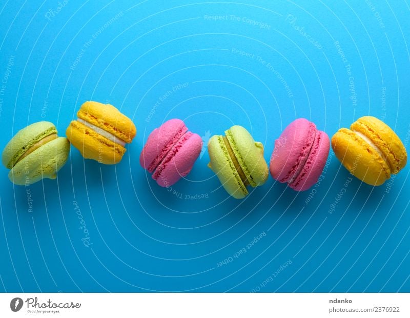 multicolored cakes Dessert Candy Bright Blue Yellow Green Pink Colour Macaron pastel background food colorful Vanilla french Vantage point Top sweet biscuit row