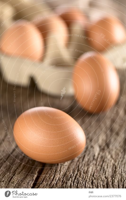 Raw Brown Eggs Nutrition Breakfast Easter Fresh food egg whole cooking Baking Protein Shell Eggshell wood Rustic Vertical raw ingredient dairy Colour photo