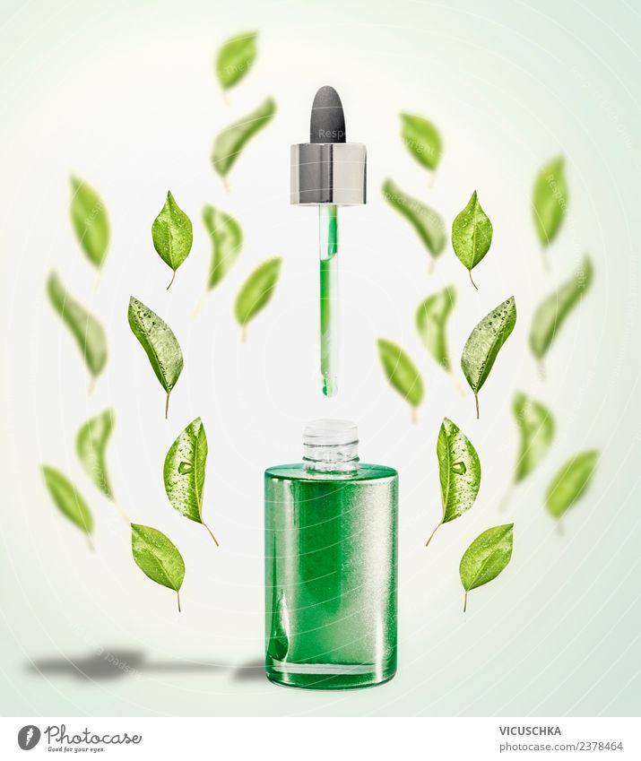 Green facial serum with pipette and green leaves Shopping Style Design Beautiful Face Cosmetics Healthy Wellness Spa Nature Leaf Serum Pipette