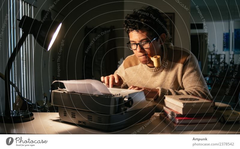 Young man working in front of a typewriter Typewriter 18 - 30 years Man Asians Writer Lamp Work and employment Literature Pipe Tobacco products Book Eyeglasses