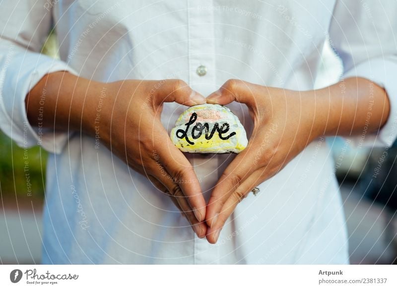 A rock with the word love written on it. Love Pregnant Rock Painting and drawing (object) Paints and varnish Art Heart-shaped Shirt White Fingers Hand Arm