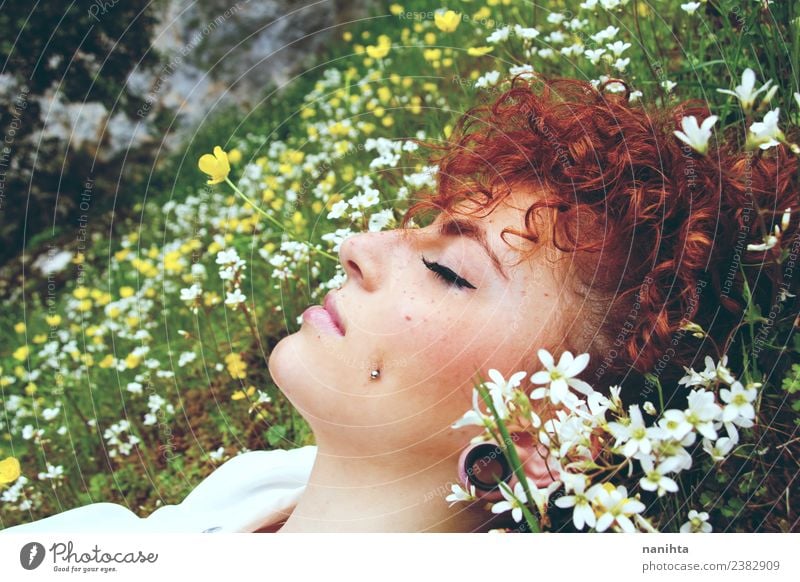 Young woman sleeping in a field of flowers Lifestyle Style Beautiful Hair and hairstyles Skin Face Healthy Senses Relaxation Calm Meditation Fragrance