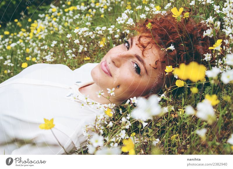 Young woman resting in a field of flowers Lifestyle Style Joy Wellness Well-being Senses Relaxation Human being Feminine Youth (Young adults) Woman Adults 1