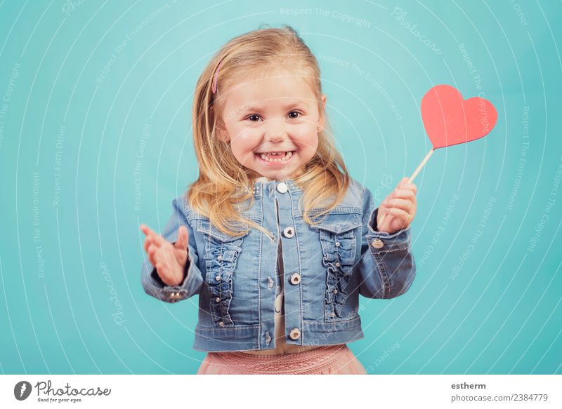 smiling baby with a heart on blue background Lifestyle Joy Feasts & Celebrations Valentine's Day Mother's Day Human being Feminine Baby Girl Infancy 1